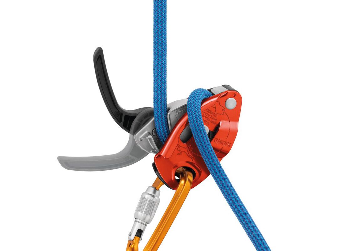 Red and orange Petzl GRIGRI belay device attached to a carabiner with a blue rope and a hand on the brake side - imagen 5