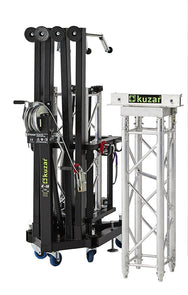 Compact folded view of the Kuzar K-10 tower lifting base on swivel wheels next to a truss section, optimized for space-saving storage and European transport.