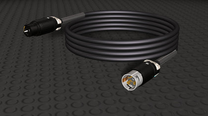 Motion Labs CS 50A Twistlock Cable coiled, with a black female connector and a male plug on the ends