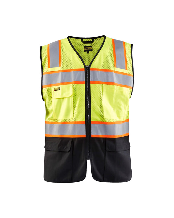 Blaklader Hi Vis Vest 3130– The long-awaited Blaklader hi-vis mesh vest is here at last. Built like the rest of our garments the quality is unrivalled in the vest arena. The contrast with black fabric allows you to work at your best while keeping the garment clean and visible as long as possible. – Now available at MTN Shop US.